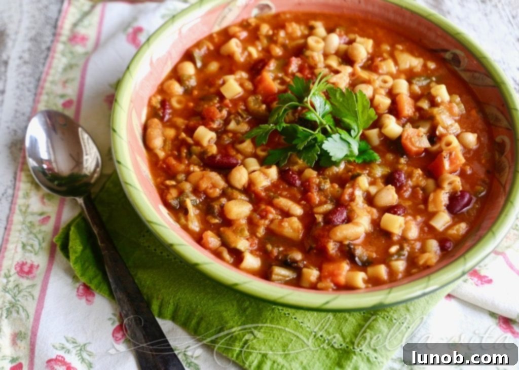 Authentic Italian Minestrone: The Definitive Classic Recipe 2 A vibrant bowl of Classic Italian Minestrone Soup with fresh vegetables and herbs, ready to be served.