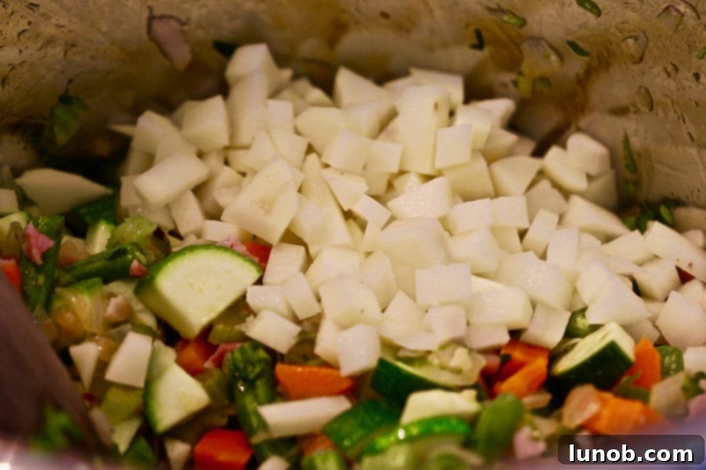 Authentic Italian Minestrone: The Definitive Classic Recipe 12 Adding slivers of fresh spinach to the Minestrone soup for added nutrients and color.