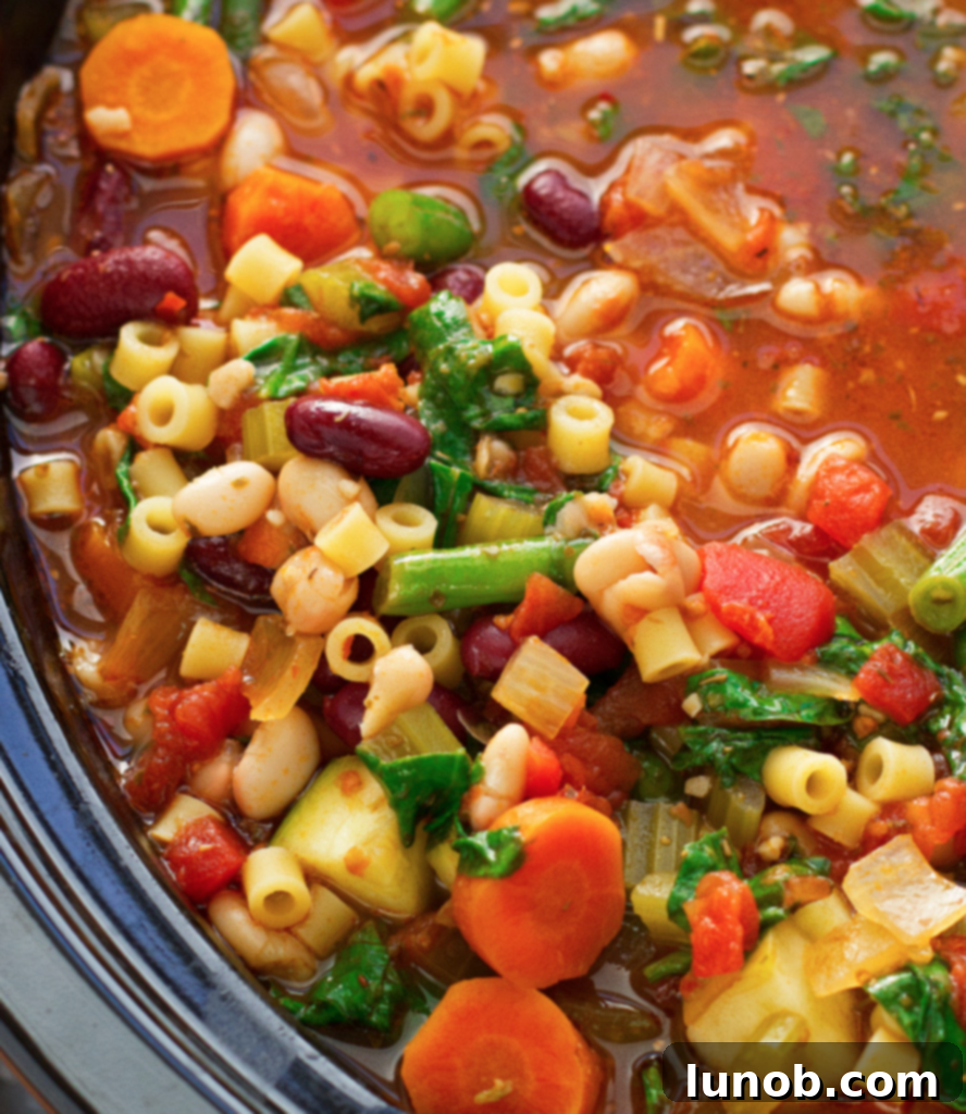 Authentic Italian Minestrone: The Definitive Classic Recipe 19 A bowl of freshly cooked Italian Minestrone soup, garnished with herbs and ready to enjoy.