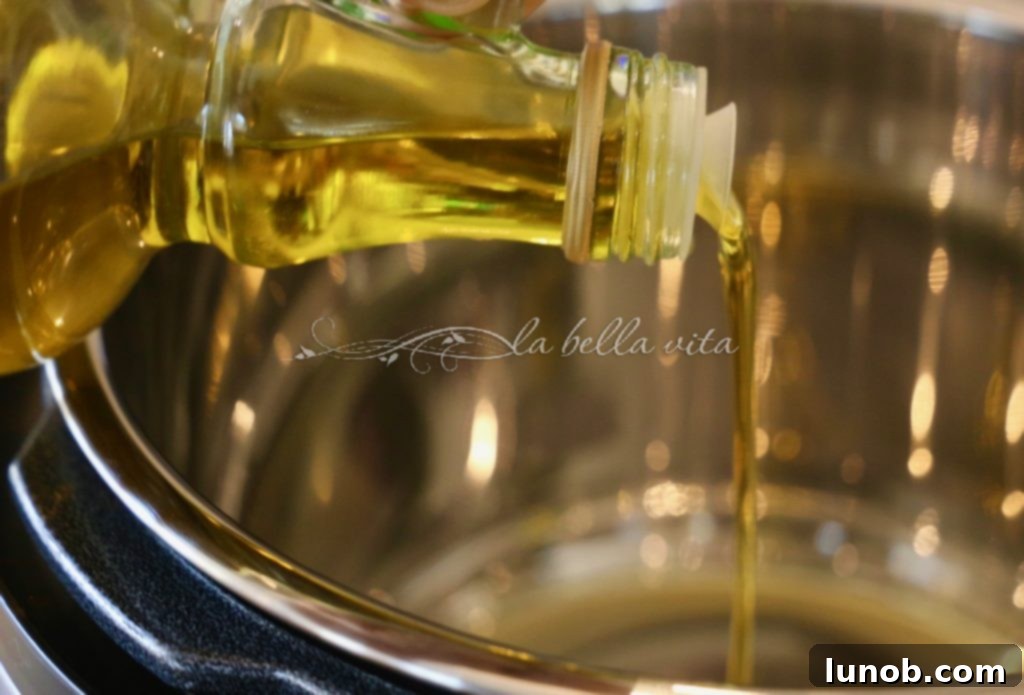 Authentic Italian Minestrone: The Definitive Classic Recipe 4 Adding chopped onions and minced garlic to the Instant Pot to sauté for minestrone.