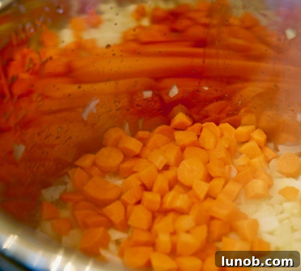 Authentic Italian Minestrone: The Definitive Classic Recipe 6 Adding chopped celery to the vegetable mixture in the Instant Pot for minestrone soup.