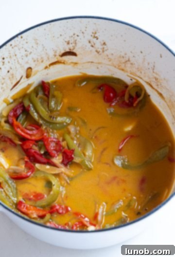 Homemade Restaurant-Style Chicken Scarpariello Perfection 11 Finishing the Scarpariello sauce by emulsifying cold butter into it for richness