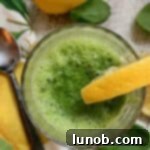 Pineapple, Spinach and Ginger Detox Smoothie recipe card image.