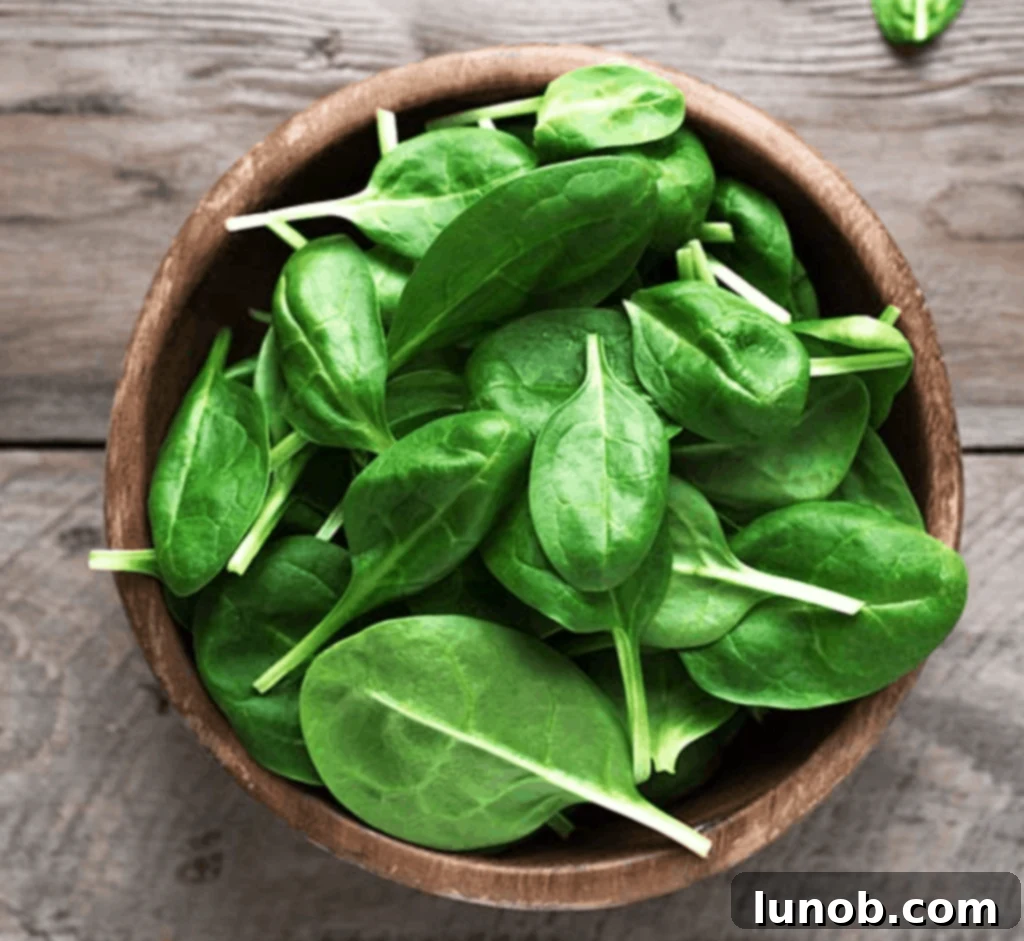 Fresh, vibrant green spinach leaves, a superfood for any detox smoothie.