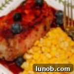 Pork Medallions with Spicy Pomegranate-Blueberry Reduction Sauce thumbnail