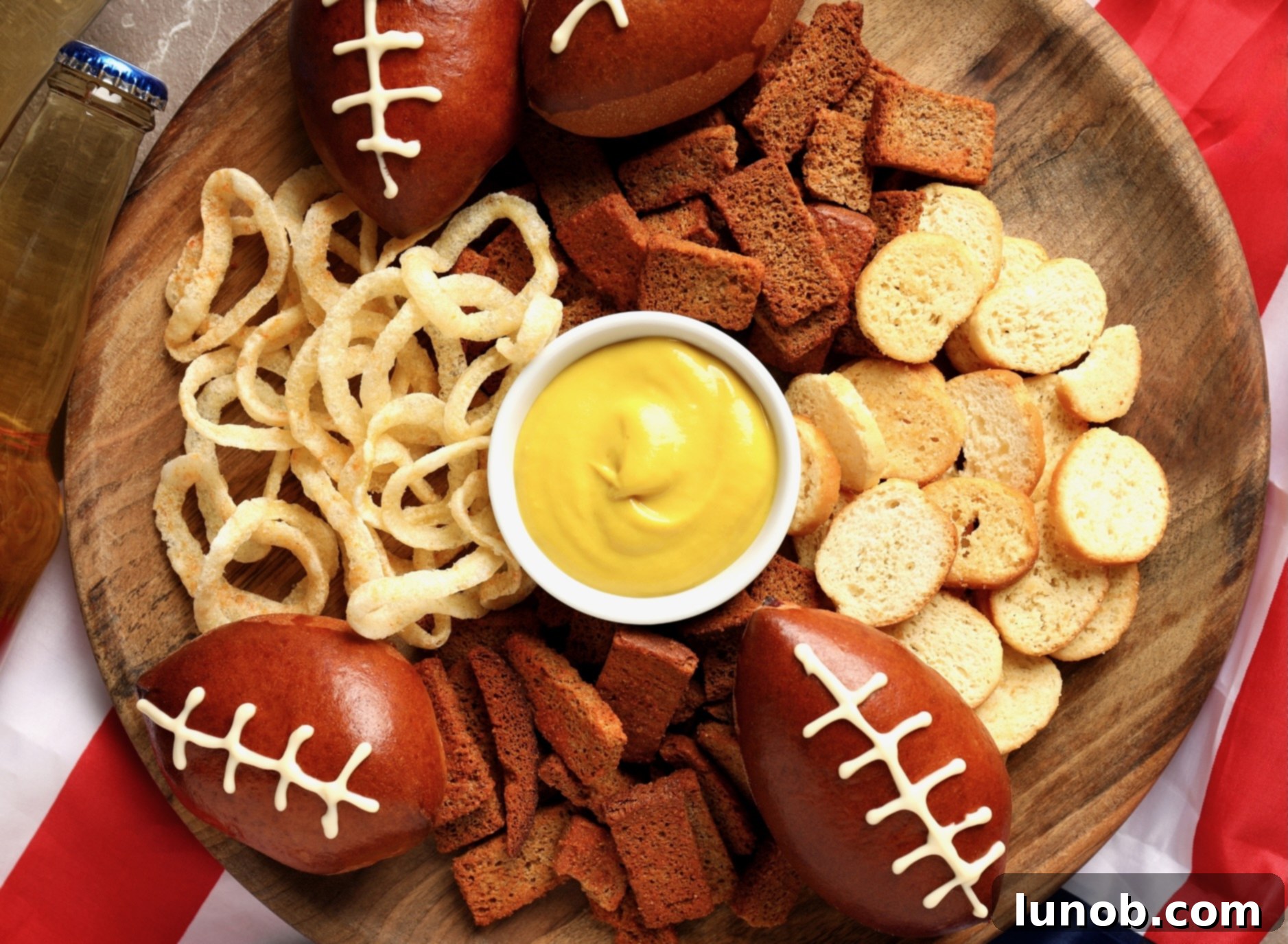Winning Game Day Eats For Every Fan 2 A festive spread of delicious game day food, including sandwiches, dips, and snacks, ready for a party.