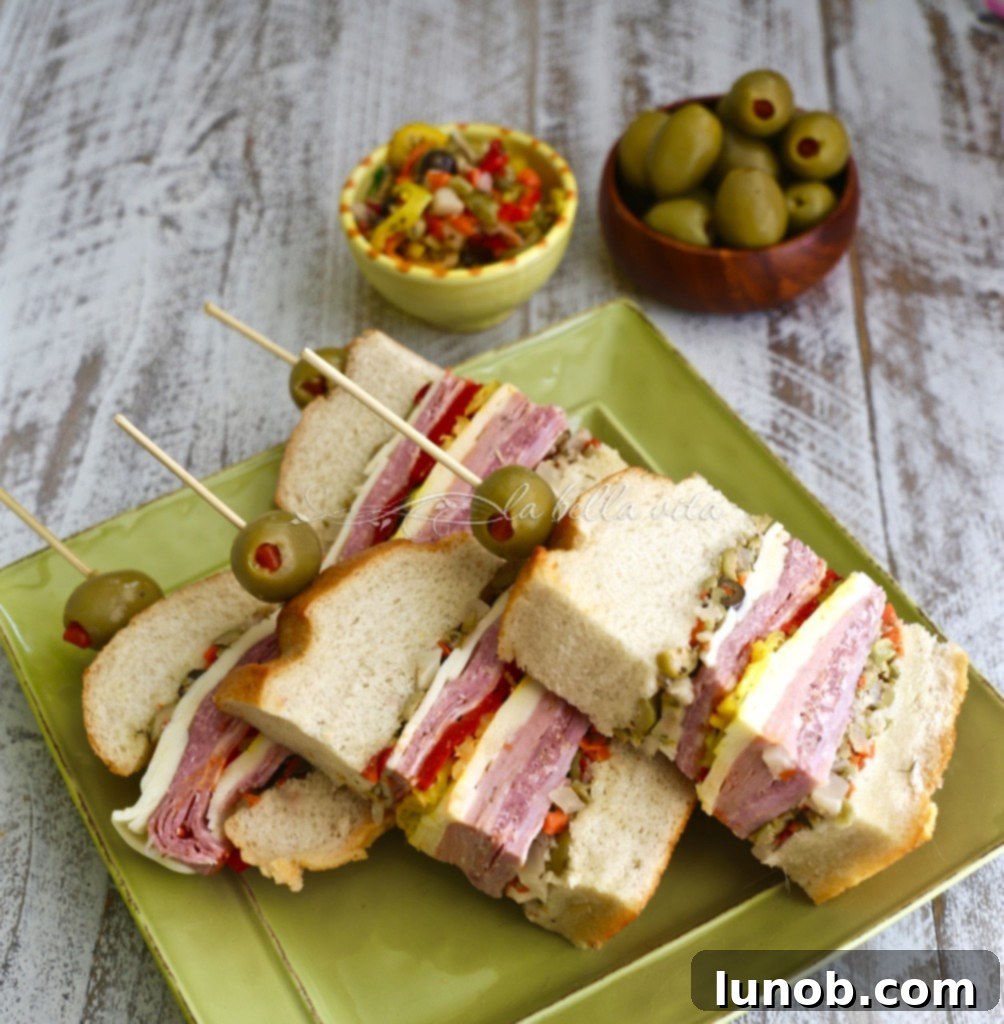 Winning Game Day Eats For Every Fan 11 Mini Muffaletta sandwiches, showing layers of meats and olive salad.