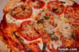 Winning Game Day Eats For Every Fan 20 Freshly grilled Margherita pizza with melted cheese, tomato, and basil.