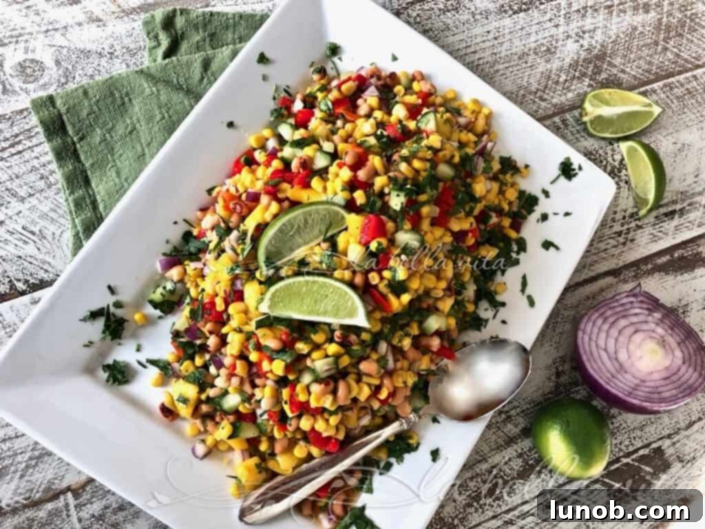 Winning Game Day Eats For Every Fan 9 A bowl of fresh corn and black-eyed pea salad dip, vibrant and ready to serve.