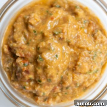 Sicilian Sun-Kissed Busiate 7 Finished Pesto alla Trapanese in a small bowl, showing its creamy yet textured consistency.