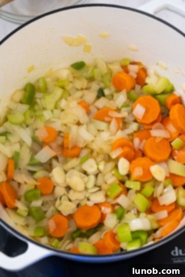 sauteing, onions, carrots, celery, and garlic