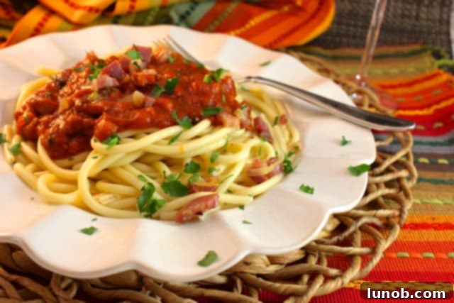 Cacio e Pepe: Rome's Iconic Pasta Perfection 13 Bucatini All'Amatriciana, a pasta dish with tomato, guanciale, and pecorino cheese.