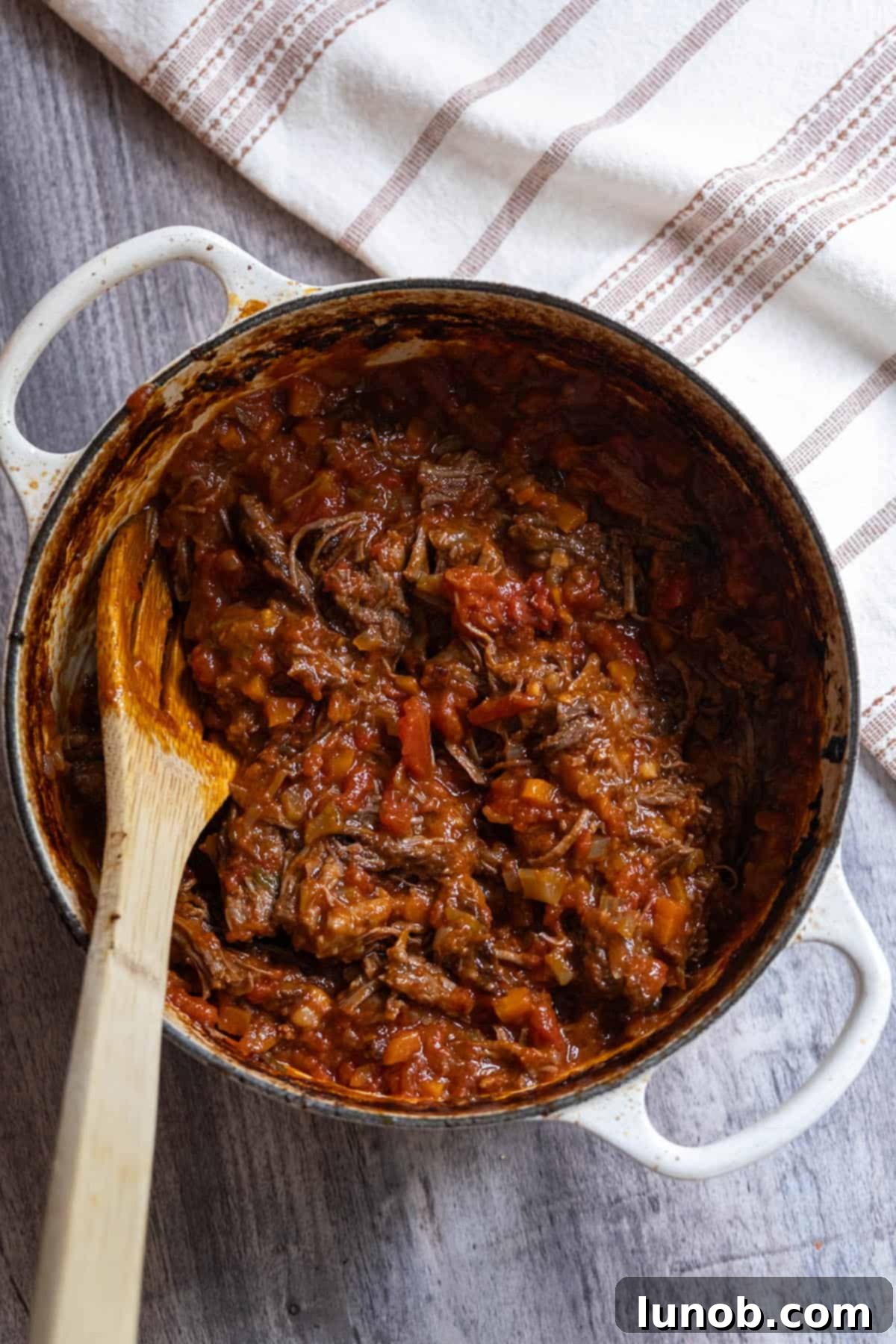 Italian braised short ribs, shredded and mixed into the ragu in the Dutch oven.