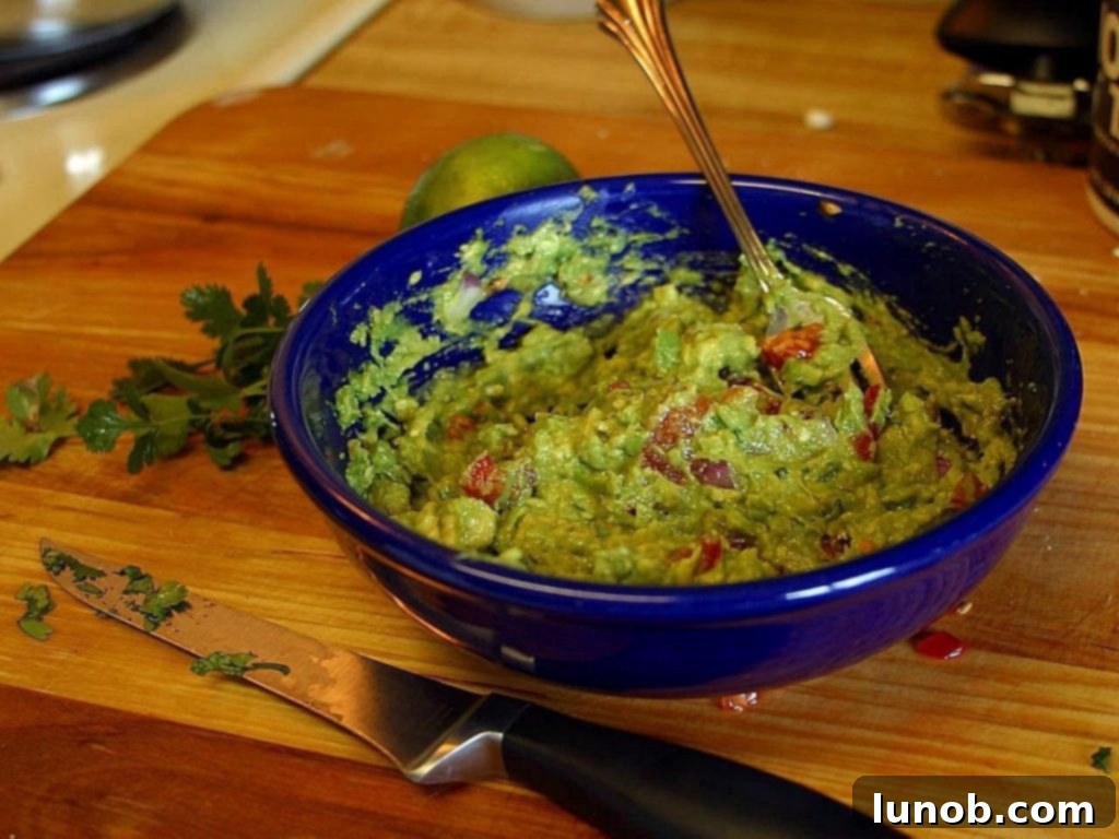 The Best Homemade Guacamole - vibrant green dip with tortilla chips