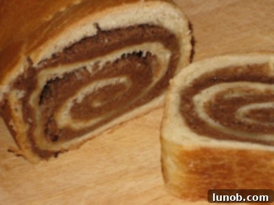 Delicious slices of Povitisa Cinnamon Nut Bread with a visible swirl of filling.