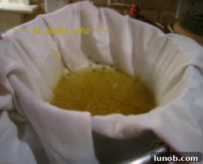 Homemade Chicken Broth for Tortellini 7 Clear, golden chicken broth after multiple straining steps.