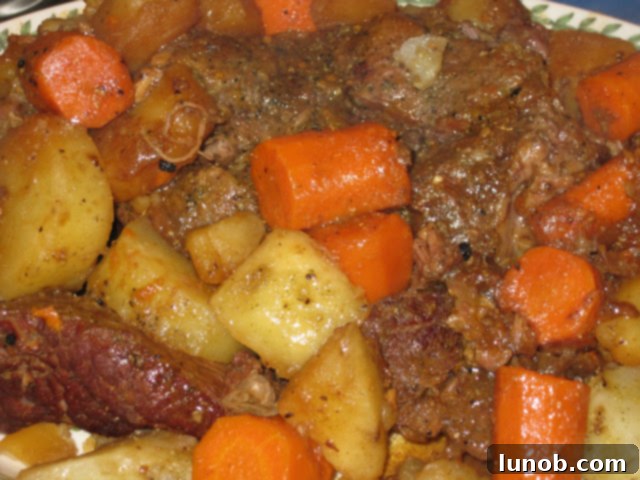 Classic Pot Roast with Carrots and Potatoes, cooked to perfection, ready to be served on a cozy winter day.