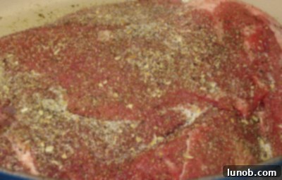 Close-up of the chuck roast perfectly seared to a deep, golden brown color.