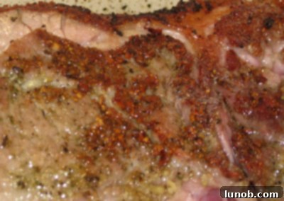 Another angle of the beautifully seared pot roast in the pot, before adding liquids.