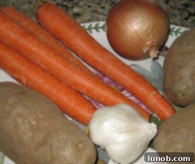 Chopped carrots and potatoes, ready to be added to the pot roast.