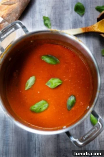 Our Eggplant Parmigiana Superior To Olive Garden 3 Sunday sauce in a pot.