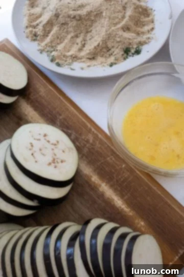 Our Eggplant Parmigiana Superior To Olive Garden 5 eegplant about to be dipped in egg and dredged in breadcrumbs