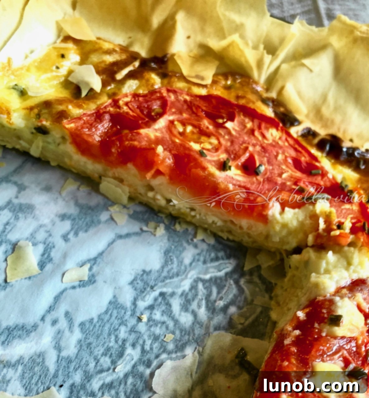 Sun-Kissed Heirloom Tomato and Italian Cheese Tart 4 Sliced Heirloom Tomato and Italian Cheese Tart revealing phyllo layers