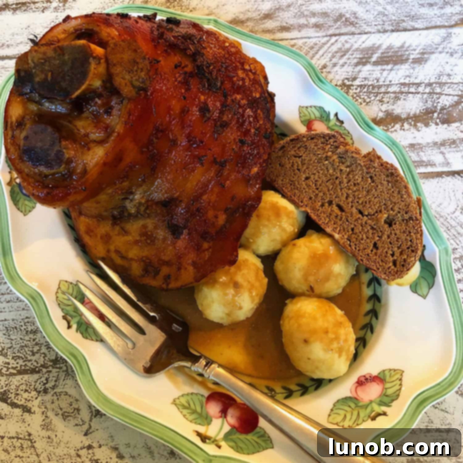 Oktoberfest Schweinshaxe: Bavarian Pork Knuckle Excellence 2 Traditional Bavarian Schweinshaxe, a crispy pork knuckle, served with sides.