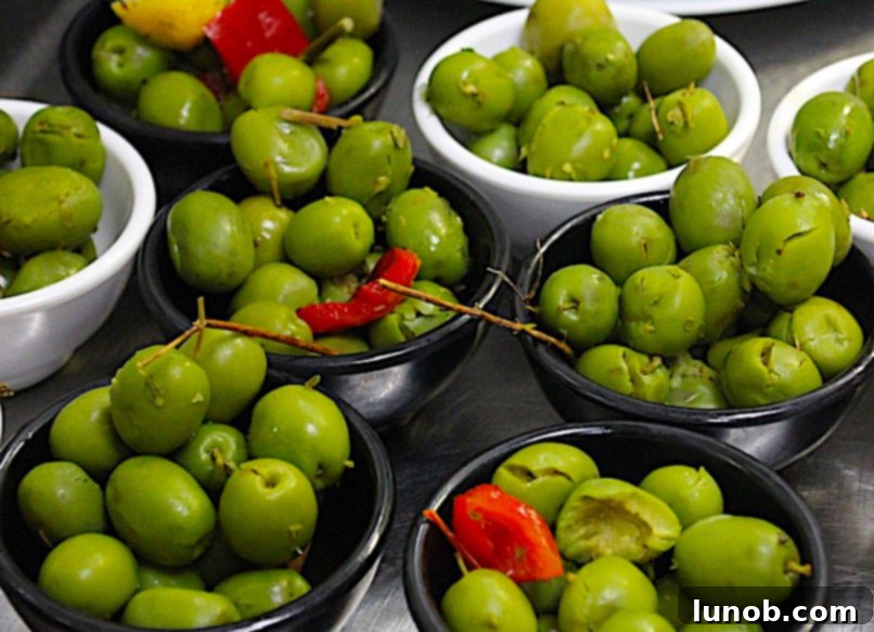 7 Insider Secrets for the Ultimate Charcuterie Board 7 Olives, roasted red peppers, and artichoke hearts as savory accompaniments