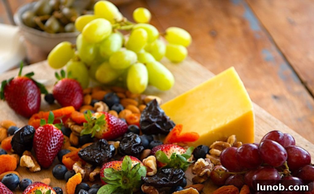 7 Insider Secrets for the Ultimate Charcuterie Board 9 Fresh grapes, berries, honey, and fig jam on a charcuterie board