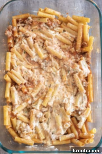 Layer of meat sauce and creamy ricotta mixture over pasta