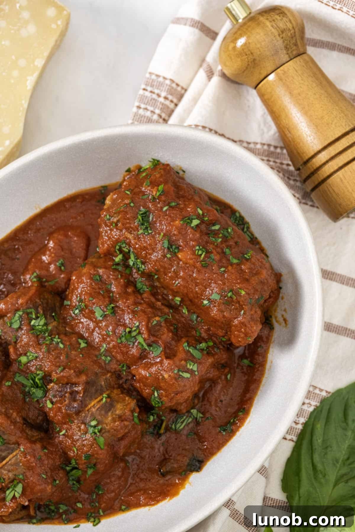 Platter of sliced Italian braciole garnished with parsley