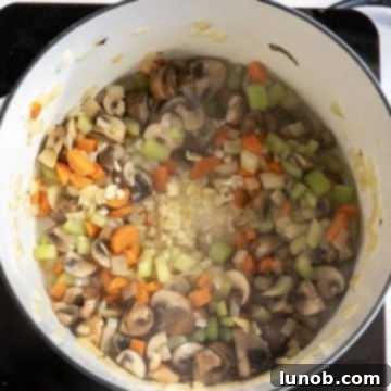 sauteing garlic and mushrooms for barley lentil soup