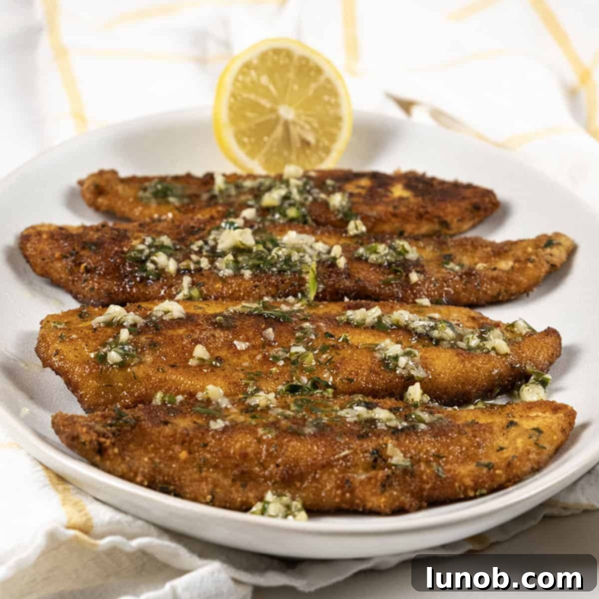 Crispy Fried Flounder Oreganata 8 Crispy fried flounder oreganata with lemon garlic butter drizzle
