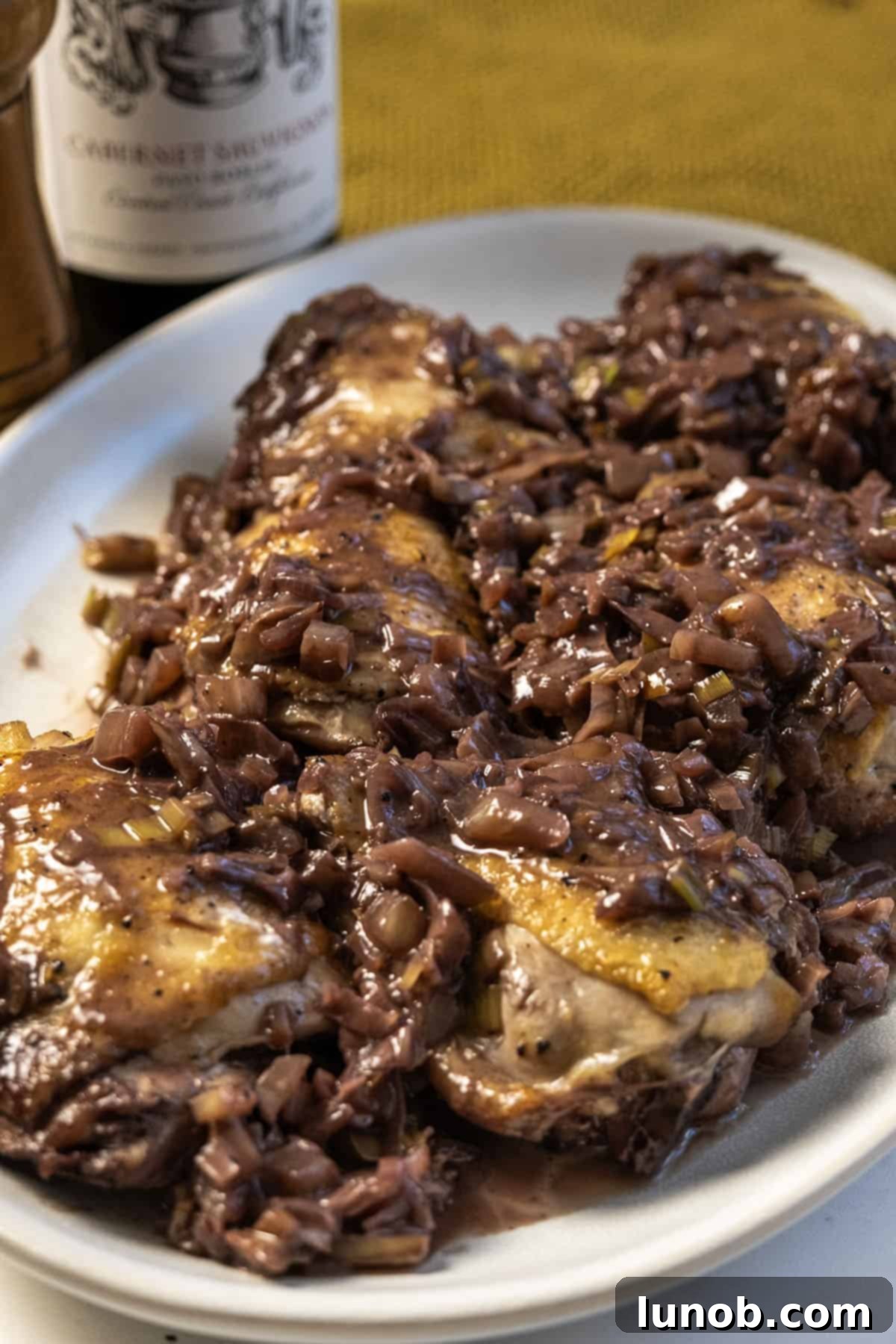 Braised Chicken Thighs with Red Wine and Fennel 2 Chicken thighs covered in red wine and fennel sauce