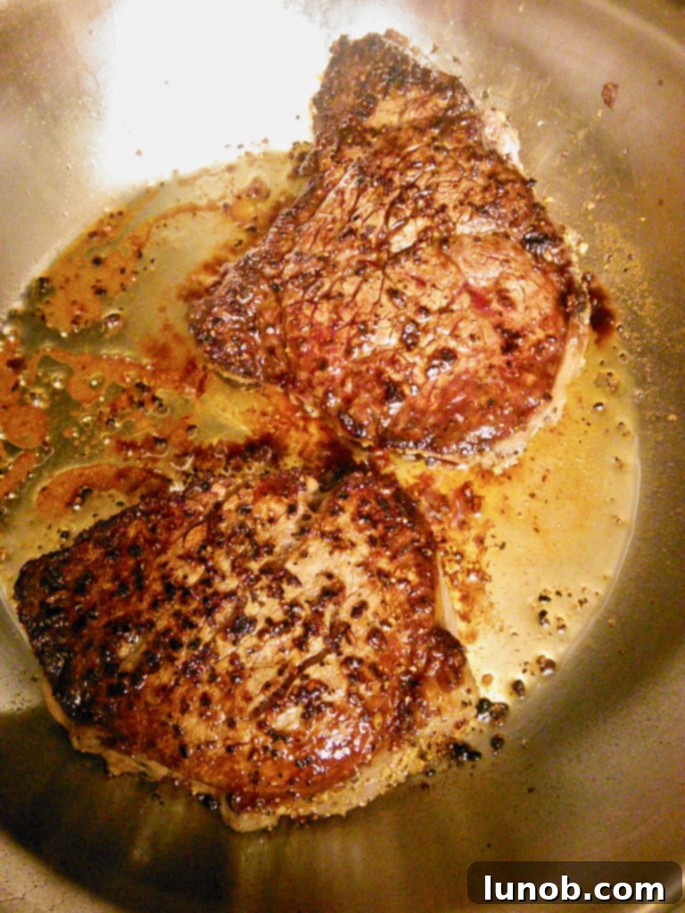 Master the Art of Pan-Seared Steak 9 Pan-seared steak with a pat of butter melting on top, as shared by Kathy