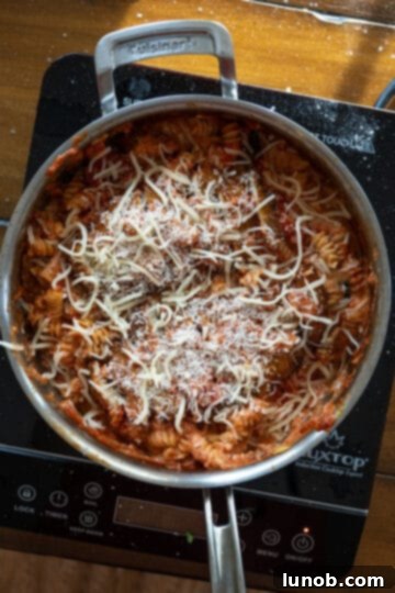 Velvety Chicken Parmesan Pasta 8 cheese on pasta before baking