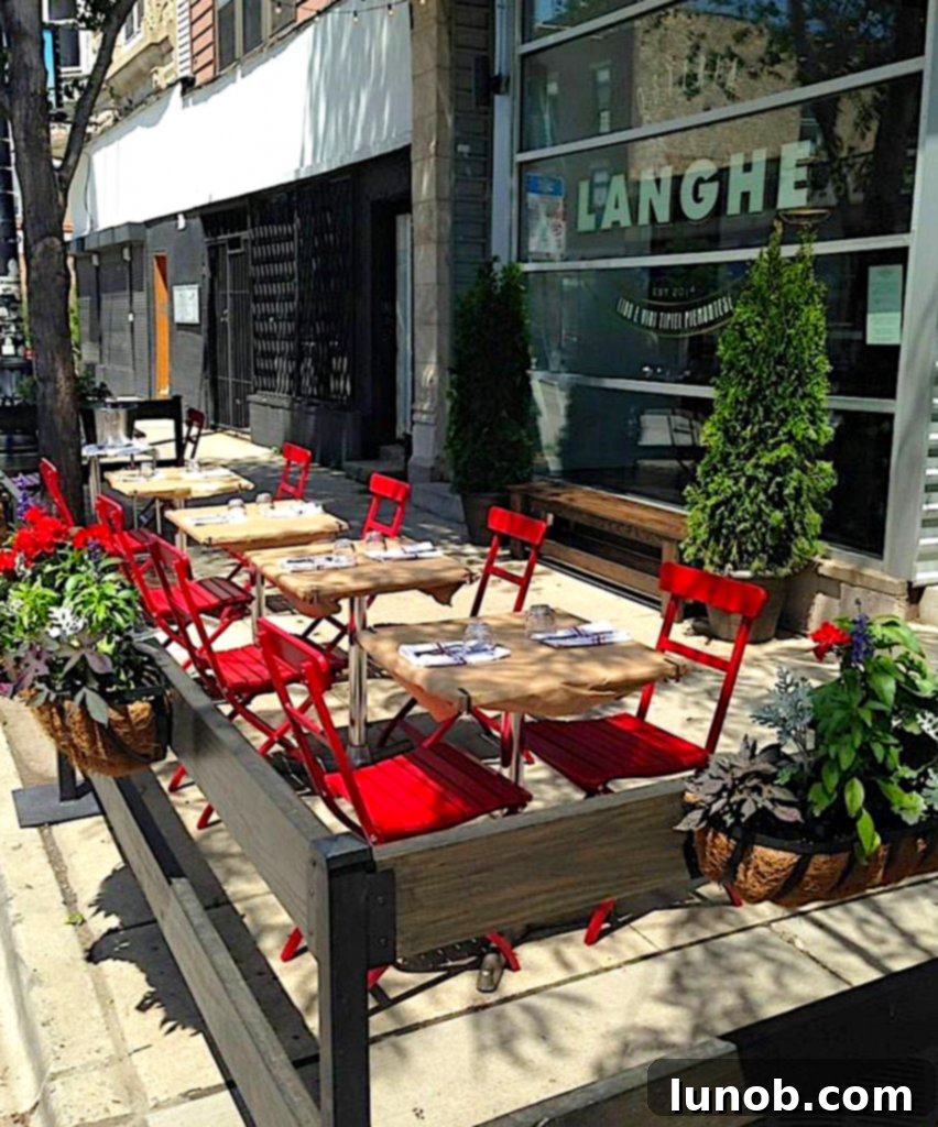 A vibrant interior shot of Osteria Langhe, showcasing its intimate ambiance with warm lighting and rustic decor, hinting at a cozy and inviting dining experience.