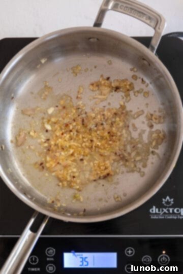 garlic, shallots and crushed reds pepper simmering with lemon