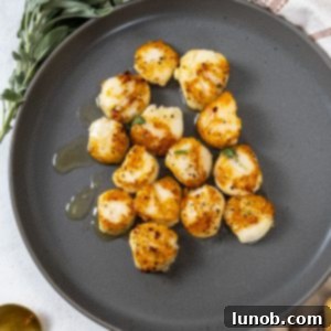 garlic sage seared scallops on a plate