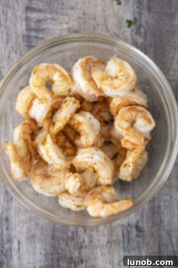 Chilled shrimp generously seasoned with Old Bay, ready for serving.