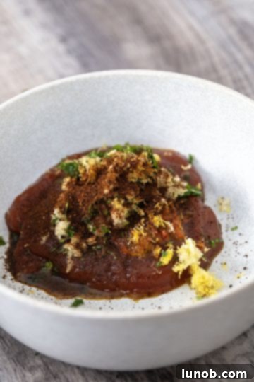 All the cocktail sauce ingredients laid out in a dish, ready to be combined.