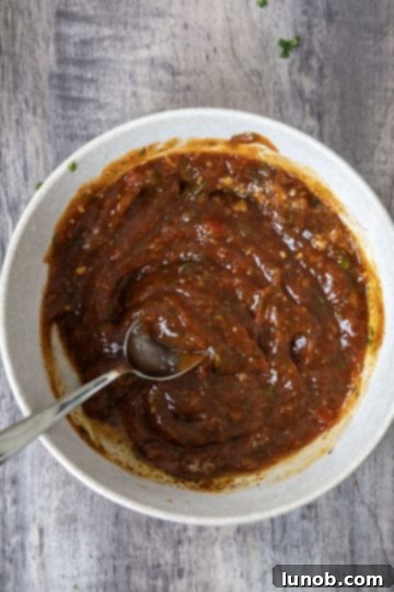 All cocktail sauce ingredients fully combined and mixed in a dish, ready for tasting and adjustment.