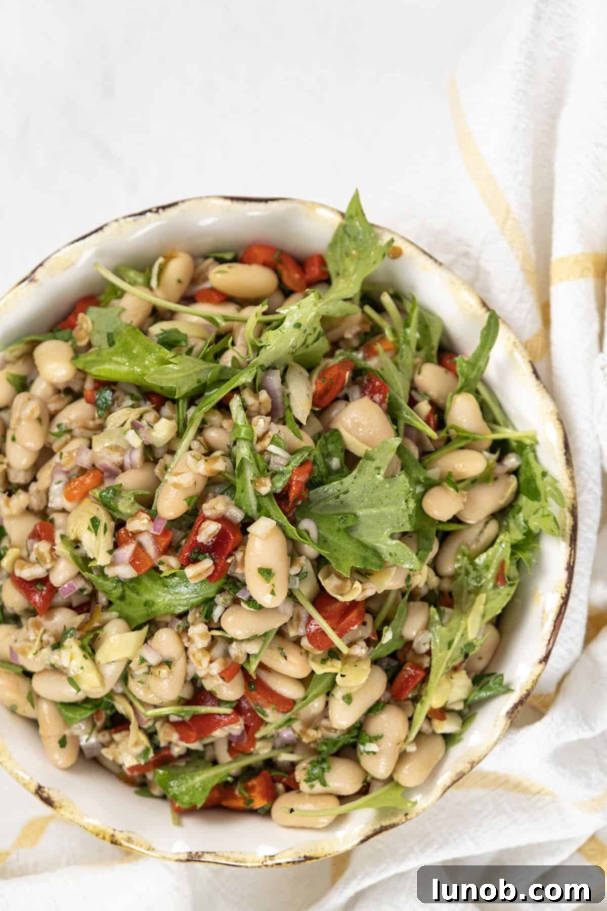 Mediterranean Farro White Bean Salad 2 A vibrant bowl of Summer Farro Salad with cannellini beans, arugula, and roasted red peppers.