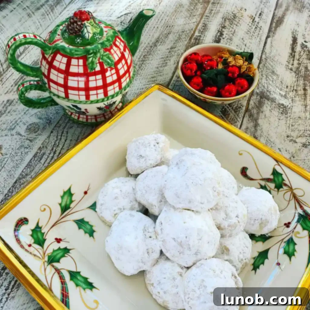 Decadent Nutella Surprise Snowballs 5 An inviting close-up of a serving plate filled with perfectly dusted Nutella Stuffed Snowball Cookies