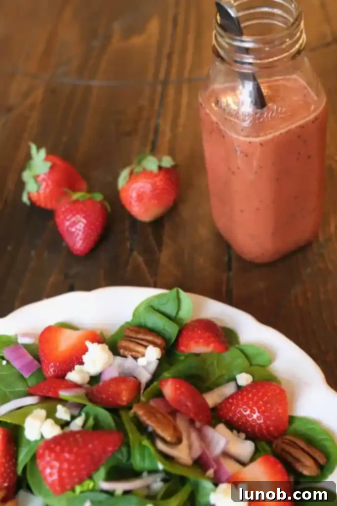 Strawberry Spinach Salad with Strawberry Balsamic Vinaigrette, ready to serve
