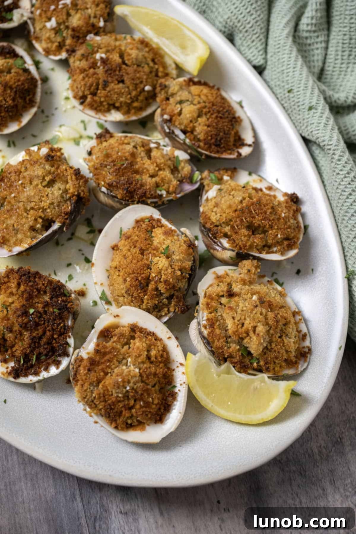 Classic Italian Stuffed Clams 2 Baked clams over lemon garlic sauce.