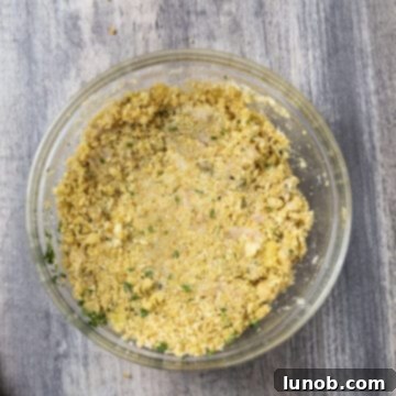 Classic Italian Stuffed Clams 6 Clams combined with breadcrumb mixture in a bowl.