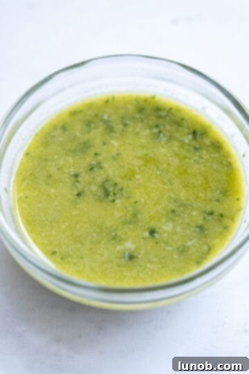 Zesty Mediterranean Chicken Pocket 4 Blended lemon basil vinaigrette in a food processor, showing its smooth, emulsified texture.