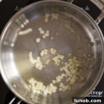 Mussels in Savory White Wine Broth 4 Finely chopped shallots sautéing gently in olive oil in a large saucepan.